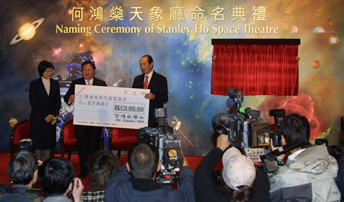 Dr Stanley Ho presents a cheque for $20 million to Secretary for Home Affairs, Dr Patrick Ho during the official naming of the Stanley Ho Space Theatre.