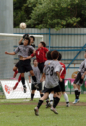 Heading for goal at an inter-district football