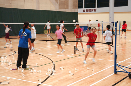 Young athletes practising at the Children Badminton Promotion Scheme.