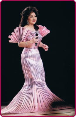 Cantonese pop singer Paula Tsui performing in a concert at the Hong Kong Coliseum.