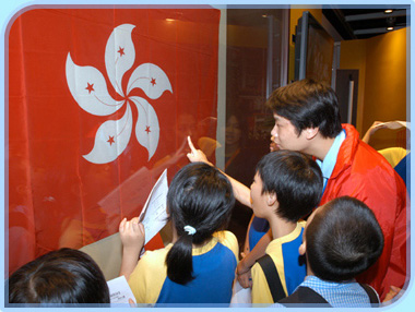 Children visiting The National Flag, Emblem and Anthem of the People's Republic of China exhibition at the Hong Kong City Hall.