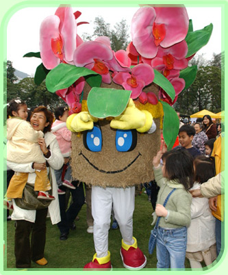 Children attracted by the Flower Show mascot at the showground.