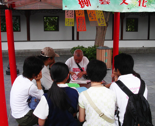 The Chinese tea house and arts and crafts stalls at the Kowloon Walled City Park are part of the activities promoting the local community economy.