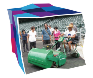 Frontline staff being trained in the use of grass-cutting machinery at Hong Kong Stadium.