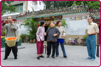 Elderly Tai O residents taking part in a dramatic performance about life in their village in olden times, in front of the Tin Hau Temple in Tai O.