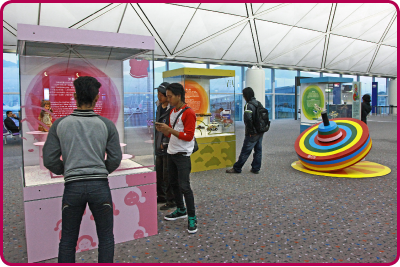 Visitors view the Childhood Memories exhibition at the Hong Kong International Airport.