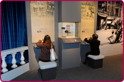 Visitors using interactive devices at the Images Through Time: Photos of Old Hong Kong exhibition.