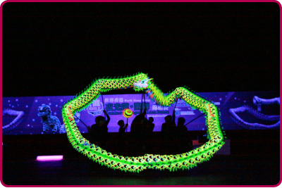 A flashing green dragon swirls and dances at the World Hong Kong Luminous Dragon and Lion Dance Championships.