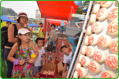 Members of the public having a good time at the Climbing Carnival of the 2013 Bun Carnival.