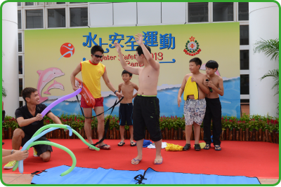 Lifeguards promoting water sports safety to young swimmers.