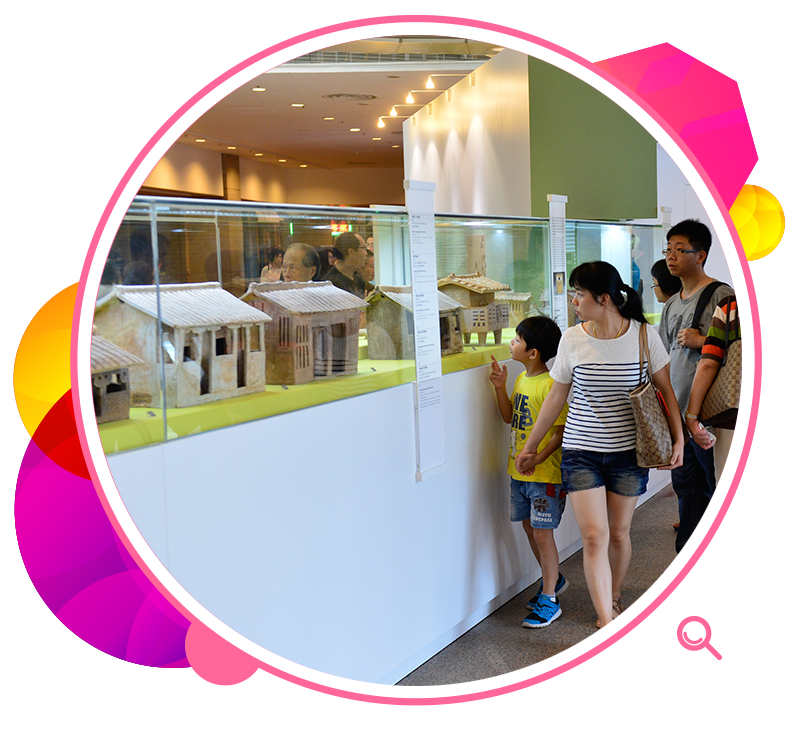 Visitors view models of burial pottery at the exhibition Assimilation into Han Culture: The Ancient Funerary Pottery of Guangxi.