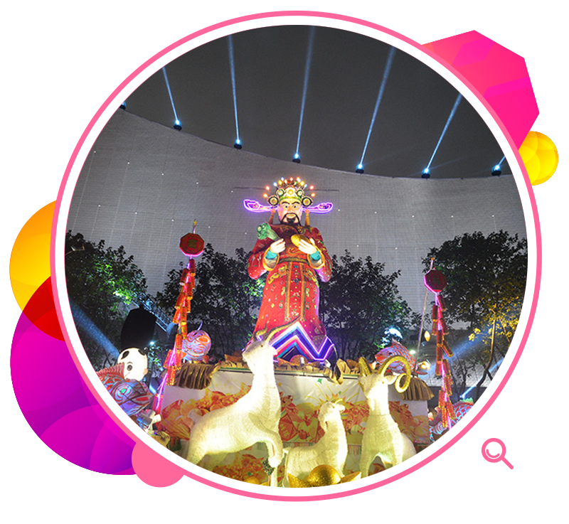 A lantern display depicting the God of Fortune with three rams.