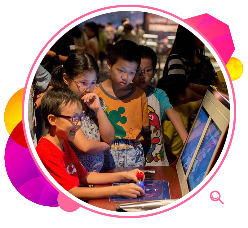 A young visitor controls the movements of a model of the Yutu Lunar Rover.