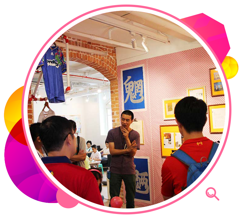 A guest curator introduces exhibits to visitors at the exhibition Sparkle! Can We Live (Together).