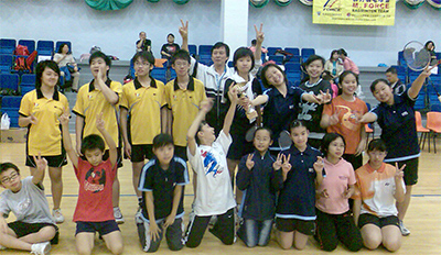 Wong Man Hing (back center) and members of the Gathering Badminton Club
