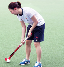 Tiffany demonstrates skills of playing hockey