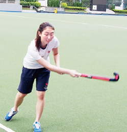 Tiffany demonstrates skills of playing hockey